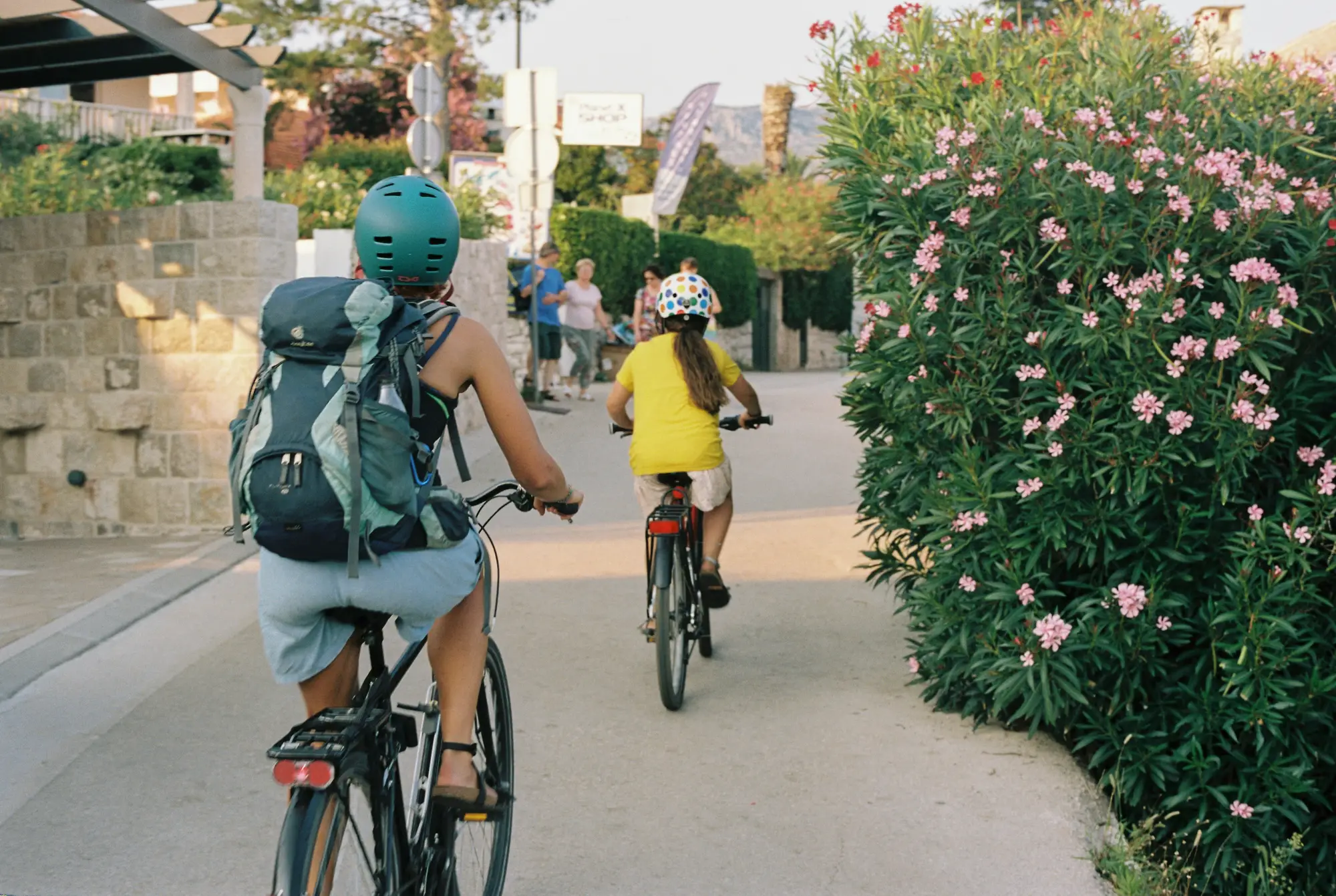 mother and child riding bikes along the island Ugljan coastline
