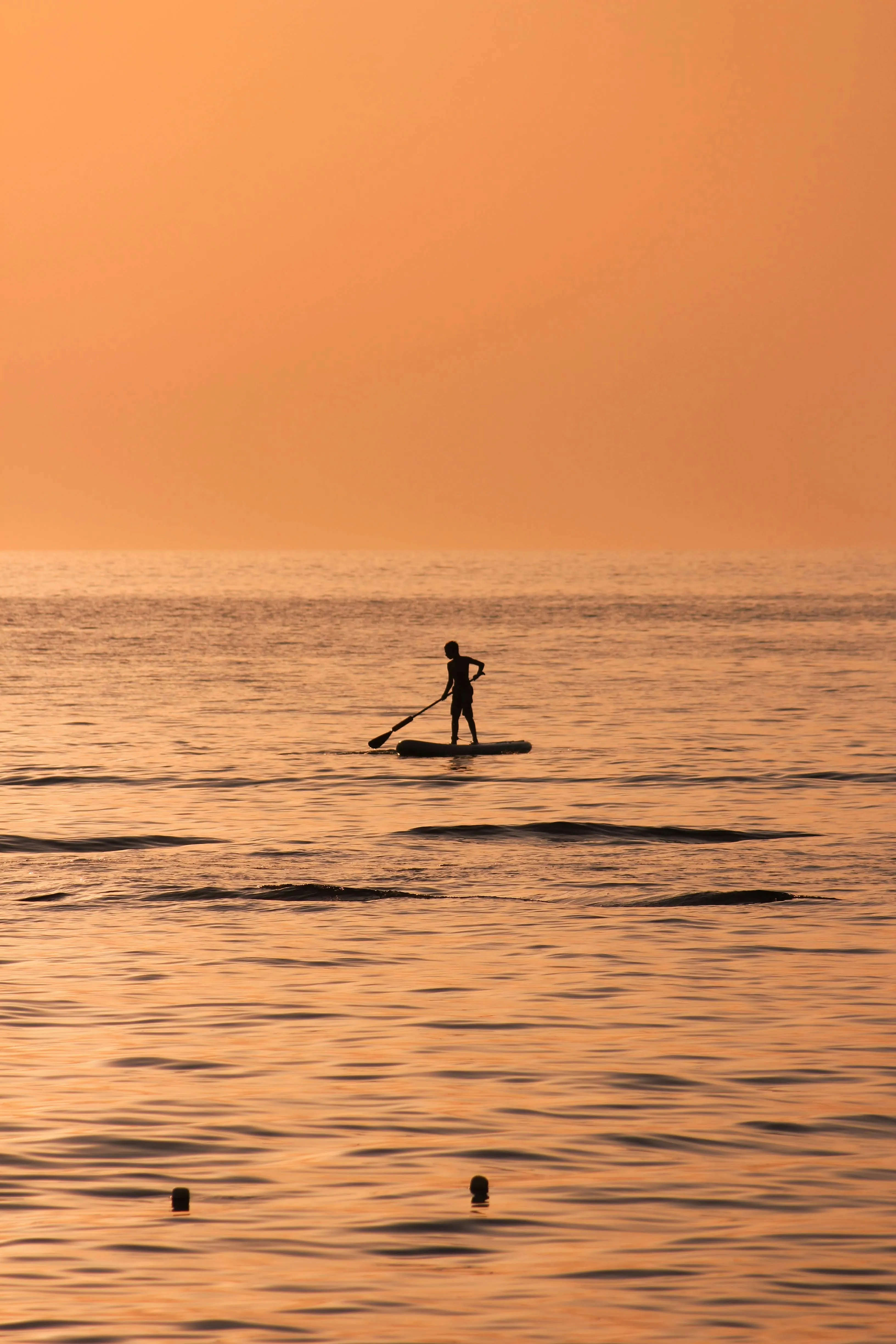 kid on stand-up paddle