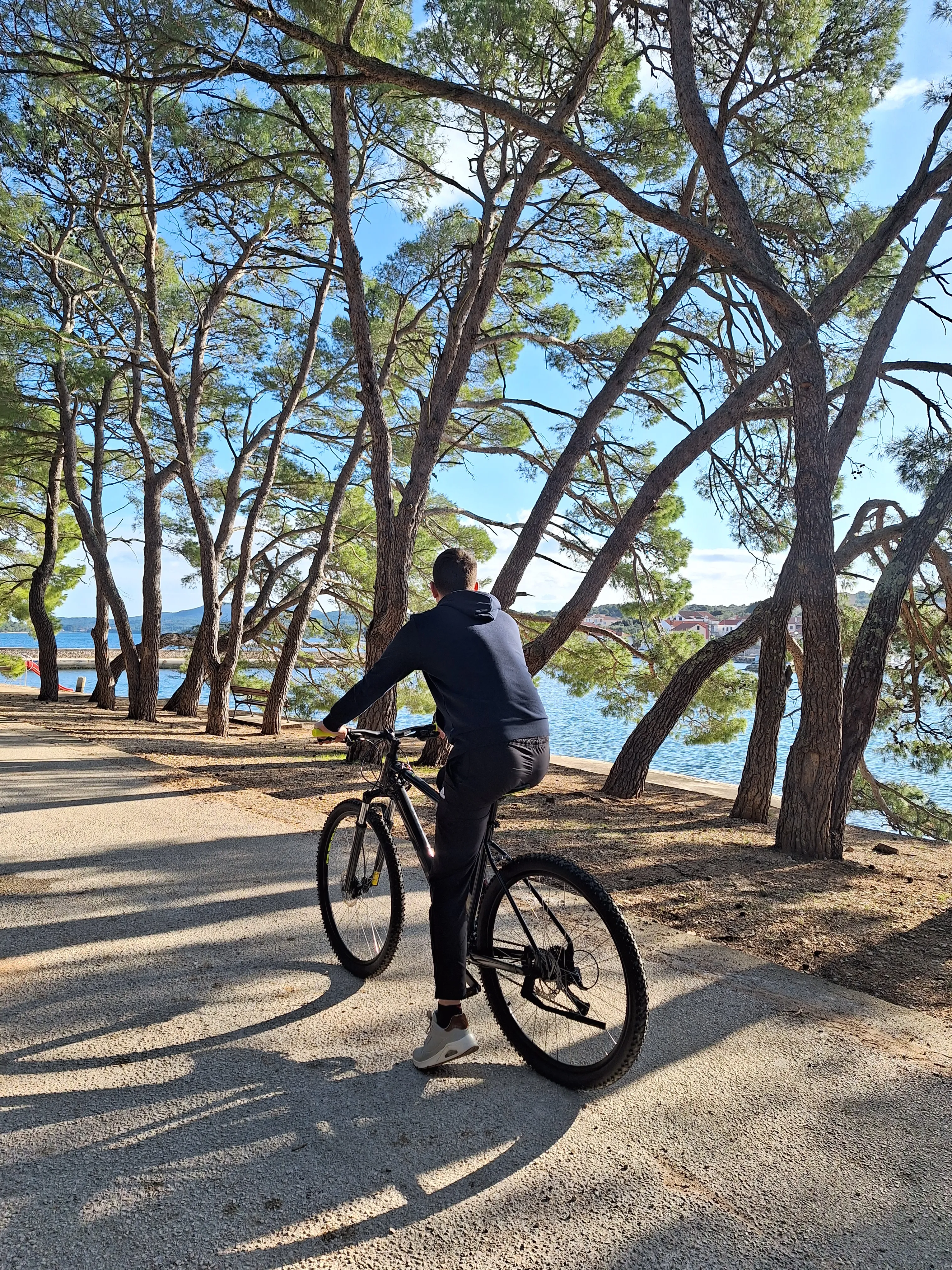 Owner of Kaliope on bike in Zelena Punta, Kukljica